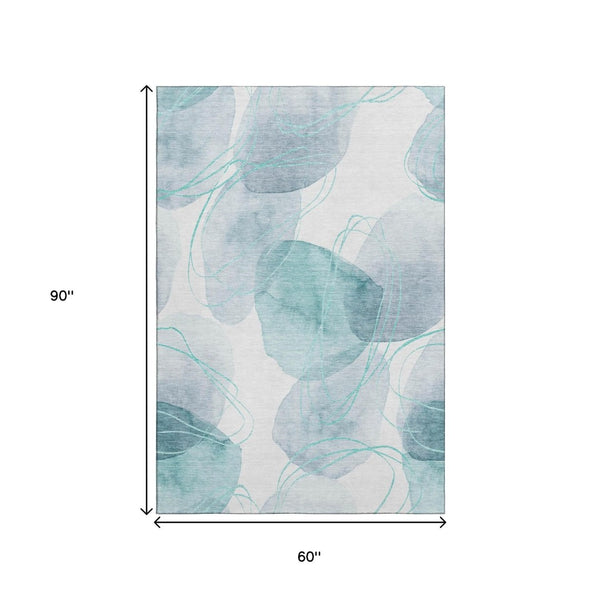 HomeRoots 5' X 8' Teal and Ivory Abstract Area Rug - Washable, UV-Protected, Durable Comfort for Busy Homes 648438