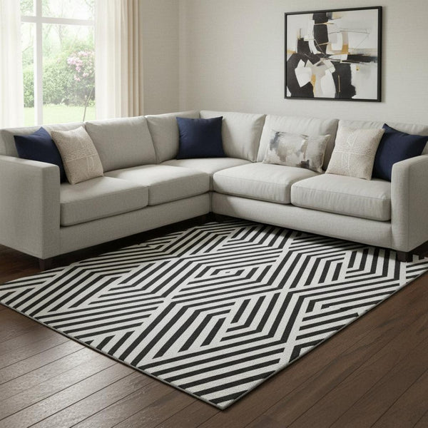 HomeRoots 8' X 10' Black and Ivory Geometric Area Rug - Washable, UV Protected, Durable for Everyday Use 648518