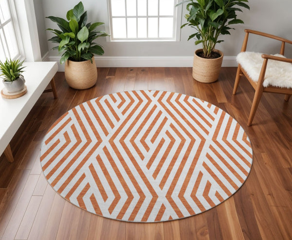 HomeRoots 8' Rust and Ivory Geometric Round Rug - Washable, UV Protected, Durable Design for Busy Homes 648577