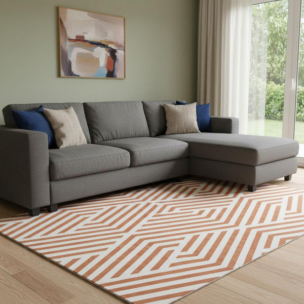 HomeRoots 10' X 14' Geometric Washable Area Rug in Rust and Ivory - UV Protected, Durable, and Stylish Design 648580