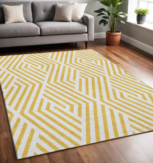 HomeRoots 5' X 8' Geometric Yellow and Ivory Washable Area Rug with UV Protection for Family-Friendly Spaces 648606