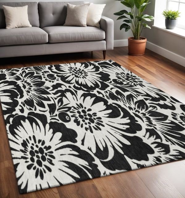HomeRoots 5' X 8' Black and Ivory Floral Area Rug - Washable, Stain-Resistant with UV Protection for Homes 648618