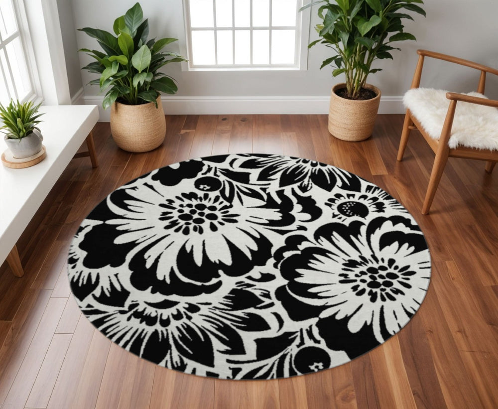 HomeRoots 8' Elegant Black and Ivory Floral Round Rug – Washable, UV Resistant, Perfect for Home and Patio Spaces 648619