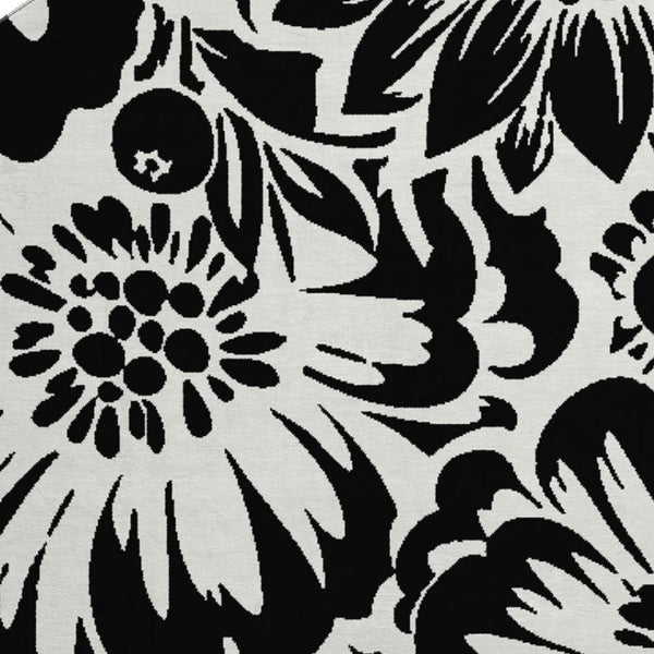 HomeRoots 8' Elegant Black and Ivory Floral Round Rug – Washable, UV Resistant, Perfect for Home and Patio Spaces 648619