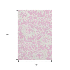 HomeRoots 5' X 8' Pink and Ivory Floral Area Rug - Washable, UV-Protected, Stylish and Durable for Any Room! 648684
