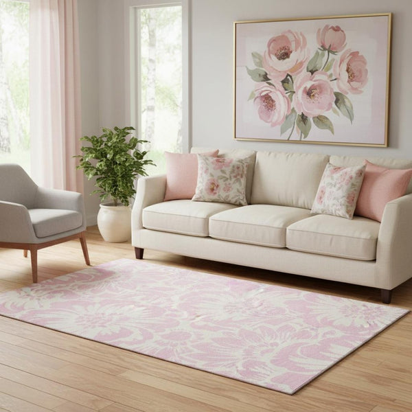 HomeRoots 5' X 8' Pink and Ivory Floral Area Rug - Washable, UV-Protected, Stylish and Durable for Any Room! 648684