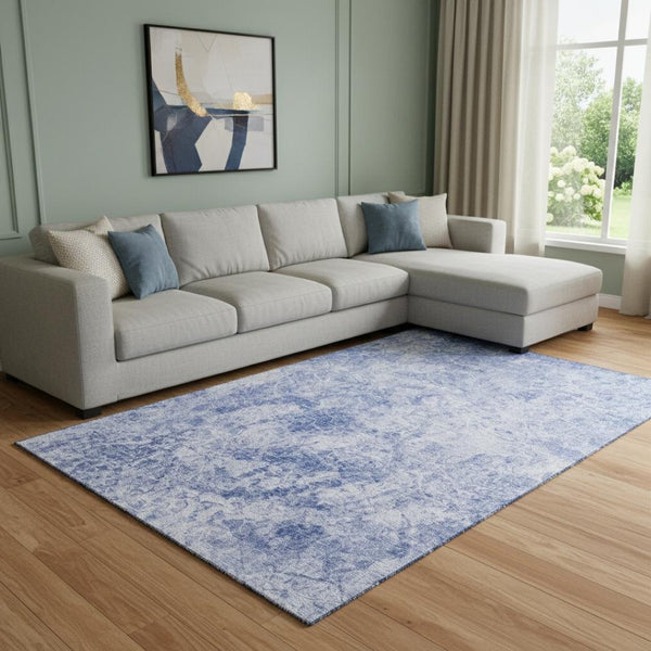 HomeRoots 10' X 14' Blue And Ivory Abstract Washable Area Rug with UV Protection for Stylish Living Spaces 648790