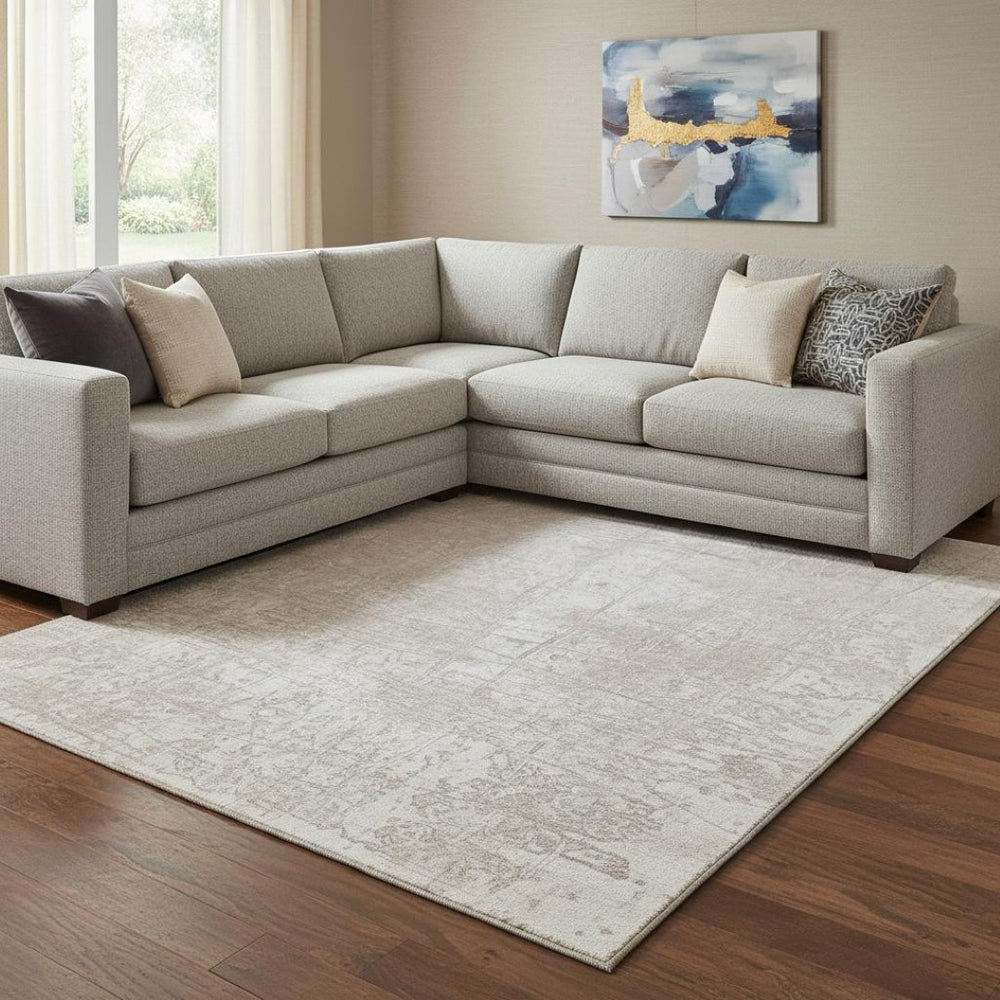 HomeRoots 9' X 12' Ivory and Cream Abstract Area Rug - Washable, UV Protected, Stain Resistant for High-Traffic Spaces 649035