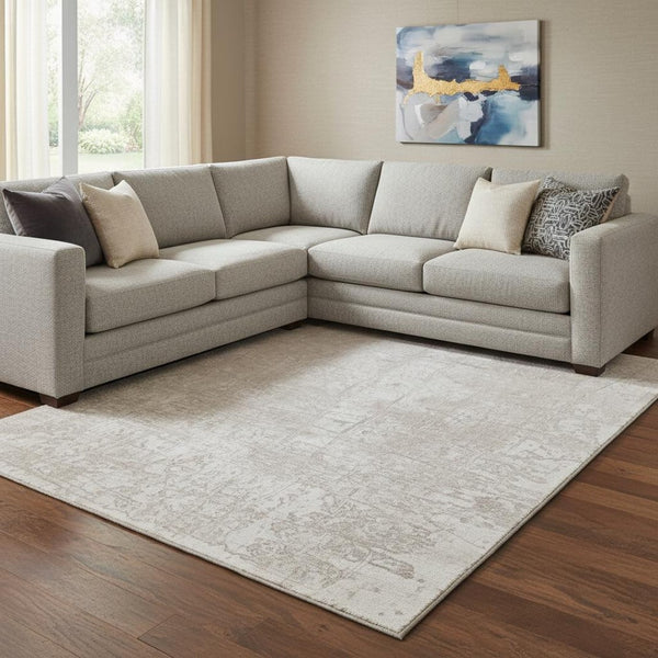 HomeRoots 9' X 12' Ivory and Cream Abstract Area Rug - Washable, UV Protected, Stain Resistant for High-Traffic Spaces 649035