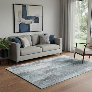 HomeRoots 5' Teal and Ivory Abstract Washable Area Rug - UV Protected, Stain Resistant, Perfect for Family Spaces 649614