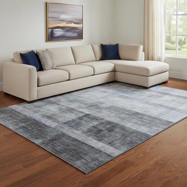 HomeRoots 9' X 12' Navy Blue & Ivory Abstract Washable Area Rug with UV Protection for High-Traffic Spaces 649635