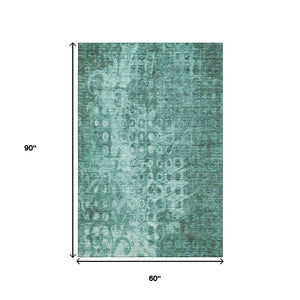 HomeRoots 5' X 8' Vibrant Teal And Ivory Ikat Area Rug - Washable, UV Protected, Stain Resistant & Durable Design 650010