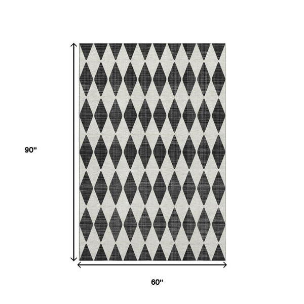 HomeRoots 5' X 8' Stylish Black and Ivory Diamond Area Rug – Washable, Durable, UV-Protected & Pet Friendly! 650022