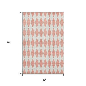 HomeRoots 5' X 8' Salmon and Ivory Diamond Area Rug - Washable, Stain-Resistant, UV-Protected for High-Traffic Areas 650112