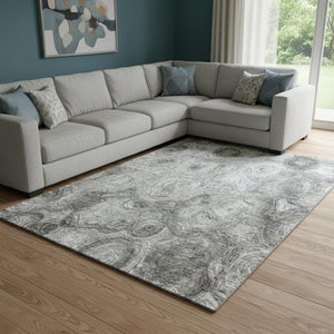 HomeRoots 10' X 14' Silver and Gray Abstract Area Rug - Washable, Stain Resistant with UV Protection for Modern Spaces 650182