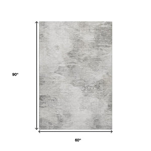 HomeRoots 5' X 8' Modern Silver and Gray Abstract Area Rug - Washable, UV Protected & Stain Resistant Design 650640