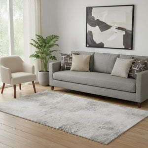 HomeRoots 5' X 8' Modern Silver and Gray Abstract Area Rug - Washable, UV Protected & Stain Resistant Design 650640