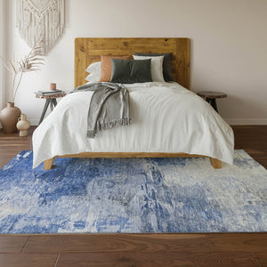 HomeRoots 8' X 10' Blue And Ivory Abstract Area Rug - Washable, UV Protected, Ideal for High-Traffic Homes 650720
