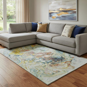 HomeRoots 9' X 12' Modern Abstract Washable Area Rug in Ivory, Yellow & Blue - UV Protected, Stain Resistant! 650961