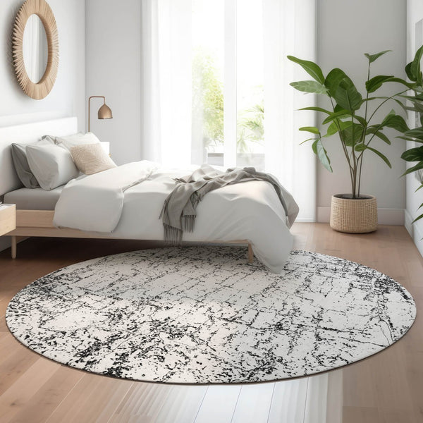 HomeRoots 8' Black And Ivory Abstract Round Rug - Washable, UV Protected, Modern Design for Busy Homes 651061