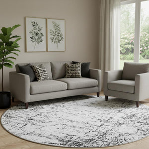 HomeRoots 8' Black And Ivory Abstract Round Rug - Washable, UV Protected, Modern Design for Busy Homes 651061