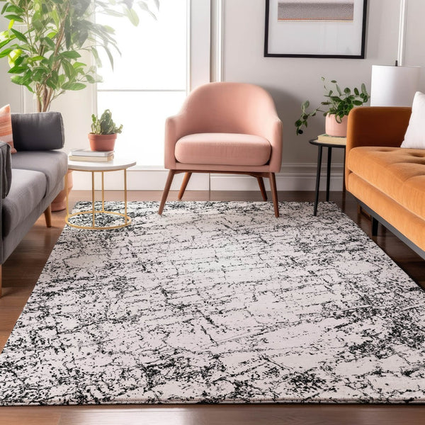 HomeRoots 10' X 14' Black and Ivory Abstract Area Rug - Washable, UV-Protected, Durable & Stylish for Your Home 651064