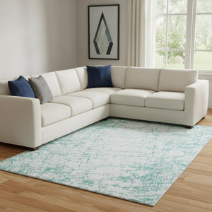 HomeRoots 9' X 12' Teal and Ivory Abstract Area Rug - Washable, UV-Protected, Durable for High-Traffic Spaces 651087