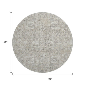 HomeRoots 8' Taupe and Ivory Floral Round Rug - Washable, Stain Resistant, UV Protected for High Traffic Areas 651223