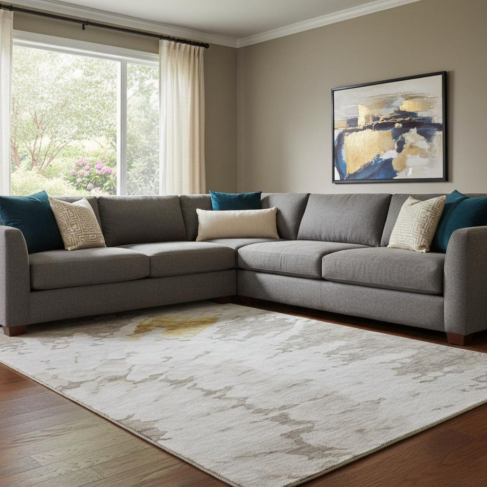 HomeRoots 9' X 12' Abstract Washable Area Rug in Taupe, Gold & Ivory with UV Protection for Modern Spaces 651315