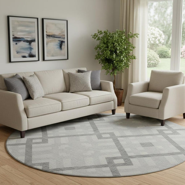 HomeRoots 8' Silver and Ivory Geometric Round Rug - Washable, UV Protected, Stylish for Living Spaces & Patios 651439