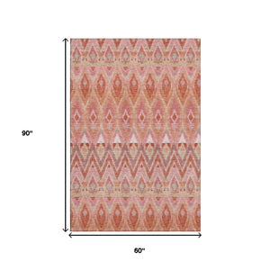 HomeRoots 5' X 8' Vibrant Southwestern Washable Area Rug in Pink, Orange & Mint Green - UV Protected & Durable 651907
