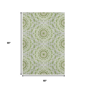 HomeRoots 5' X 8' Green and Ivory Geometric Washable Area Rug - Soft, Durable, UV-Protected for High Traffic Areas 652223