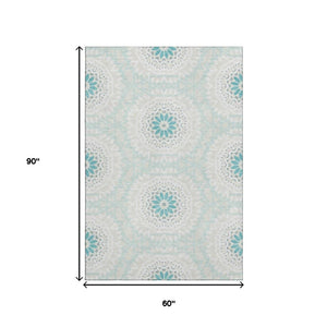 HomeRoots 5' X 8' Teal and Ivory Geometric Area Rug with UV Protection, Stain Resistant for Modern Homes 652295