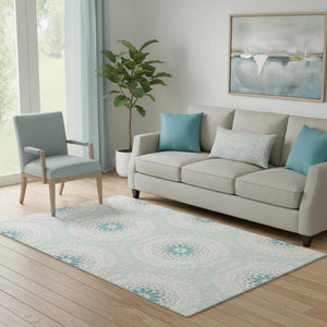HomeRoots 5' X 8' Teal and Ivory Geometric Area Rug with UV Protection, Stain Resistant for Modern Homes 652295