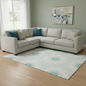HomeRoots 8' X 10' Teal and Ivory Geometric Area Rug - Washable, Stain Resistant, UV Protected for High Traffic Areas 652297