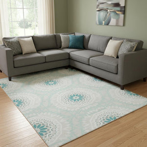 HomeRoots 9' X 12' Teal and Ivory Geometric Area Rug - Washable, UV Protected, Perfect for High-Traffic Spaces! 652298