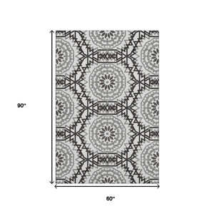 HomeRoots 5' X 8' Stylish Black and White Geometric Area Rug - Washable, UV Protected, Easy Care for Homes 652307