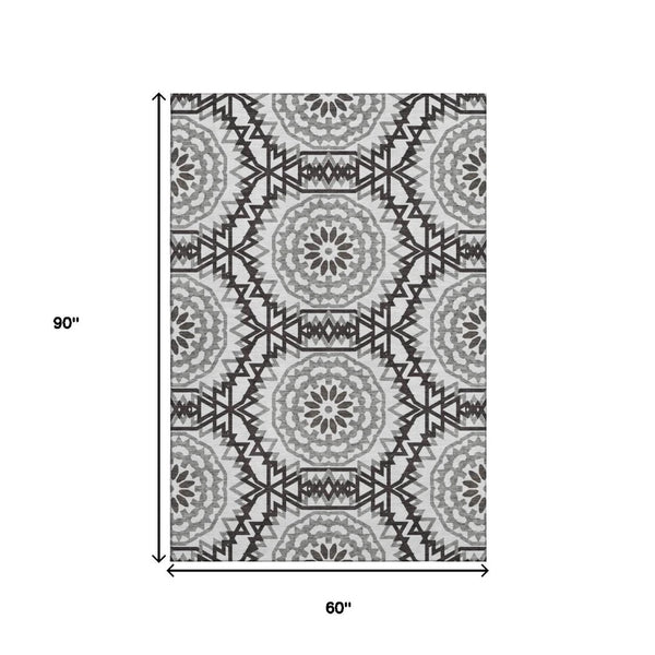 HomeRoots 5' X 8' Stylish Black and White Geometric Area Rug - Washable, UV Protected, Easy Care for Homes 652307