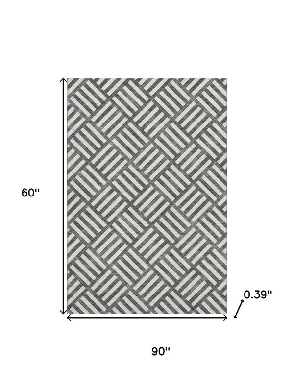 HomeRoots 5' X 8' Black And Ivory Geometric Washable Area Rug - Stylish, UV-Protected, Durable for Busy Spaces 652325