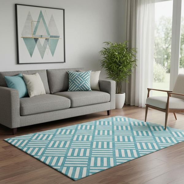 HomeRoots 5' X 8' Teal and Ivory Geometric Area Rug – Stain Resistant, UV Protected, Machine Washable Design 652433