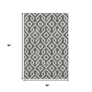 HomeRoots 5' X 8' Black And Ivory Geometric Area Rug – Durable, Washable, UV-Protected for High-Traffic Spaces 652463