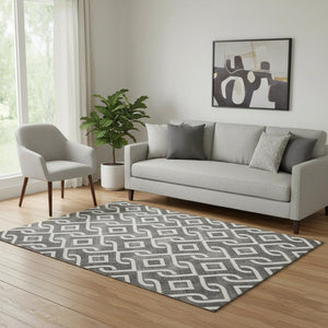 HomeRoots 5' X 8' Black And Ivory Geometric Area Rug – Durable, Washable, UV-Protected for High-Traffic Spaces 652463