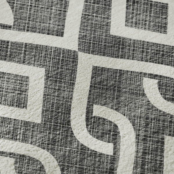 HomeRoots 8' X 10' Modern Black and Ivory Geometric Area Rug – Washable, UV Protected for Everyday Living 652465