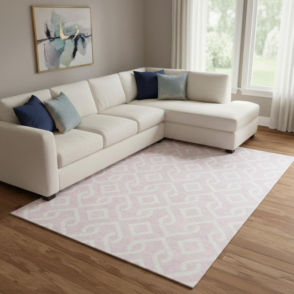 HomeRoots 8' X 10' Pink and Ivory Geometric Washable Area Rug - Stylish, UV-Protected, Easy-Care for Modern Spaces 652549