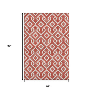 HomeRoots 5' X 8' Red And Ivory Geometric Area Rug - Washable, UV Protected, Perfect for Kids & Pets! 652565