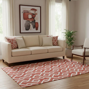HomeRoots 5' X 8' Red And Ivory Geometric Area Rug - Washable, UV Protected, Perfect for Kids & Pets! 652565