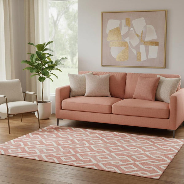 HomeRoots 5' X 8' Salmon and Ivory Geometric Area Rug - UV Protected, Stain-Resistant, Soft Polyester Comfort 652577