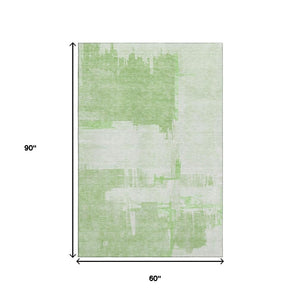 HomeRoots 5' X 8' Green And Ivory Abstract Area Rug – Washable, UV-Protected, Perfect for Kids & Pets! 652691