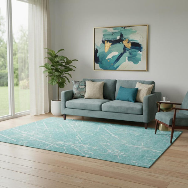 HomeRoots 5' X 8' Teal and Ivory Abstract Area Rug - Washable, UV Protected, Stylish for Family Rooms & Play Areas 652847