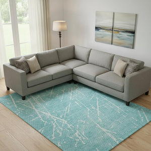 HomeRoots 9' X 12' Teal & Ivory Abstract Washable Area Rug – Durable, Stylish, UV-Protected for Busy Homes! 652850